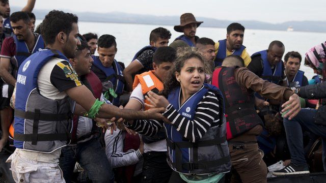 Syrian refugees arriving on a boat