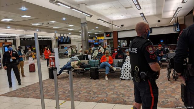 Passengers in airport after police called over a mask dispute with a baby