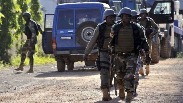 Malian troops take position outside the Radisson Blu hotel in Bamako, Mali on November 20, 2015