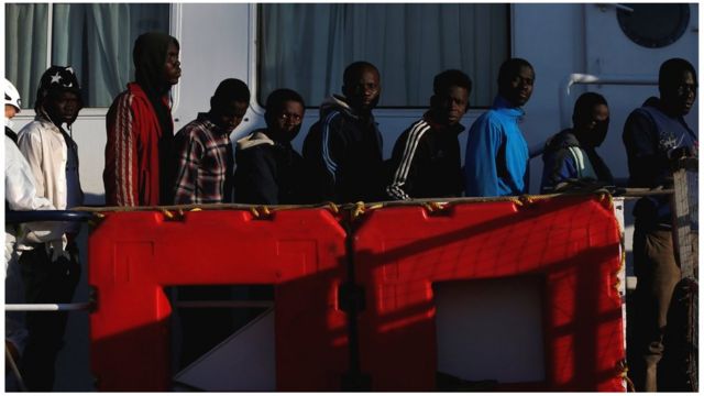 Rescued migrants wait to disembark from the Malta-based NGO Migrant Offshore Aid Station (MOAS) ship Phoenix in Pozzallo on the island of Sicily, Italy, 6 April 2017