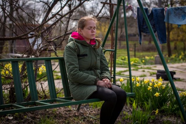 Maria Sayenko in her garden in Hurivshchyna. "It's like he disappeared into thin air," she said.