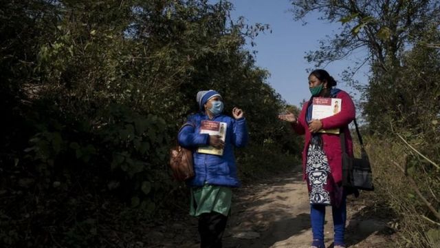 Two nurses discuss the health situation