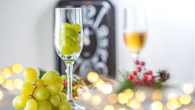 Twelve grapes with a hint of midnight is a tradition that has spread throughout Latin America.