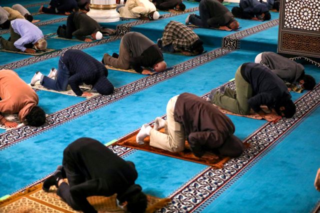 Worshippers praying in a mosque