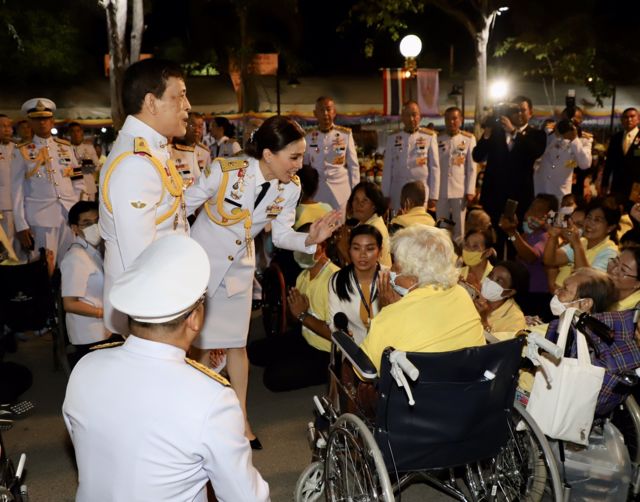 The king and queen meet people