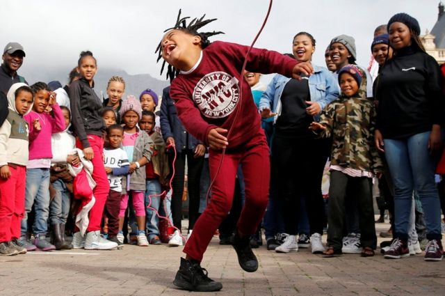 A child plays on a skipping rope during as people gather to commemorate what would have been Nelson Mandela's 99th birthday in Cape Town, South Africa, July 18, 2017.