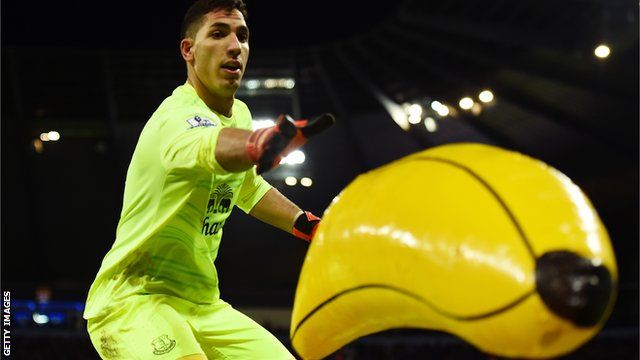 Everton keeper Joel Robles removes an inflatable banana from the pitch during the League Cup semi-final against Manchester City at the Etihad Stadium in 2016
