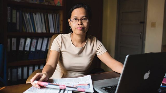 Chak Sopheap director from the Cambodian centre for human rights sits behind her desk