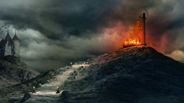 Pintura sobre un cuerpo siendo devorado por las llamas en lo alto de un montículo.