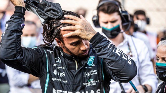 Lewis Hamilton looks dejected after losing world title