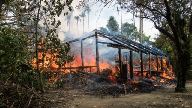 A Rohingya village which was burnt on 7 September - Ms Suu Kyi said violence had stopped before then