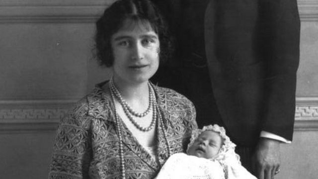 The Queen Mother with Princess Elizabeth in her arms