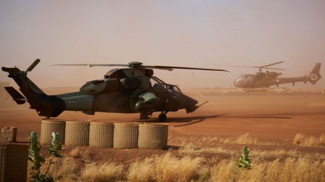 A Eurocopter Tiger (Eurocopter EC665 Tigre) helicopter (L) is seen at the French Military base in Gao, in northern Mali on November 8, 2019