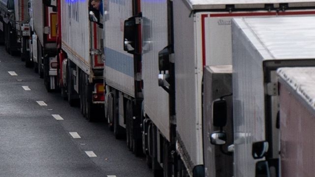 Lines of parked trucks waiting to be allowed across the border into France