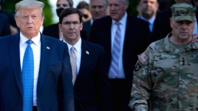 Gen Milley (R) was on the walk with the president and Defence Secretary Mark Esper (C)