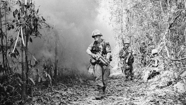 US soldiers patrol a jungle area near the Cambodian border