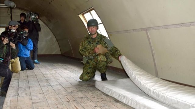 An SDF members shows the mattress where Yamato Tanooka had been sleeping (3 June 2016)