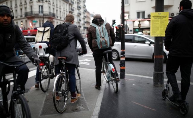 People ride bikes on the streets of Paris during a strike by French SNCF railway workers on 5 December, 2019