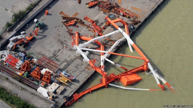 a crane that toppled due to strong winds in Nishinomiya city, Hyogo prefecture on September 5, 2018, after typhoon Jebi hit the west coast of Japan.