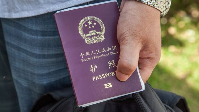 A man holds a Chinese passport in his hand (file picture)
