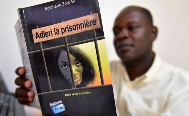 A man reads the book "Adieri la prisonniere" (Adieri the prisoner) by Ivorian writer Epiphane Zoro Bi in Abidjan on May 15, 2018. Written by Ivorian judge Epiphane Zoro Bi, this book tells the story of Ituri, a northeastern province of the DRC, where since 1999 clashes between Hemas pastors and Lendu farmers have led to the death of more than 60,000 people and have displaced 600,000