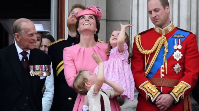 (L-R) Prince Philip, Duchess of Cambridge (with Princess Charlotte and Prince George) and Prince William stand on the balcony of Buckingham Palace to watch a fly-past of aircraft by the Royal Air Force in London - June 2017