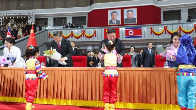 Xi Jinping and Kim Jong-un attend a performance