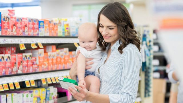 Mother shopping with a baby. Did you know you can buy 'breast shields' to collect excess breast milk and give your nipples a break?