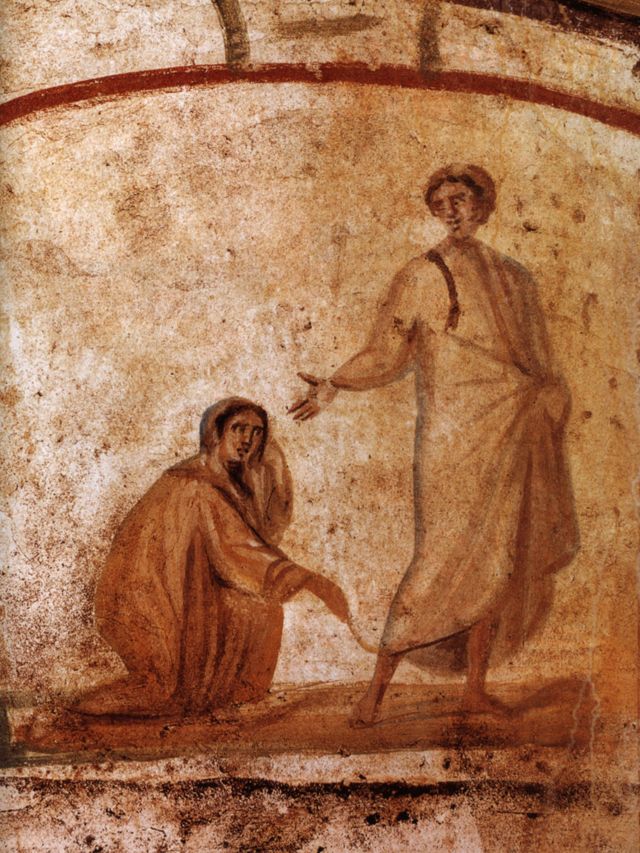 Jesus and woman touching his mantle