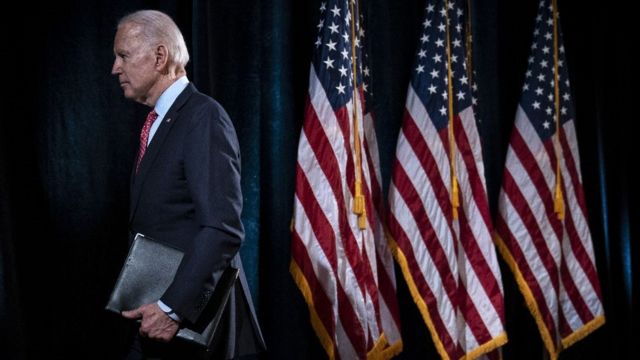 Joe Biden walks off stage.