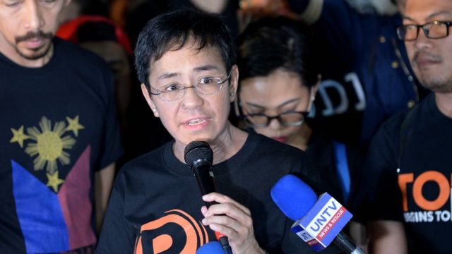 Maria Ressa (C), the CEO and editor of online portal Rappler, speaks during a protest on press freedom