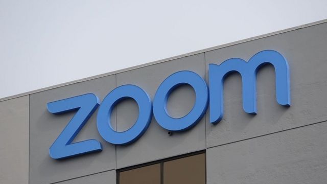The Zoom logo is seen on the side of a building