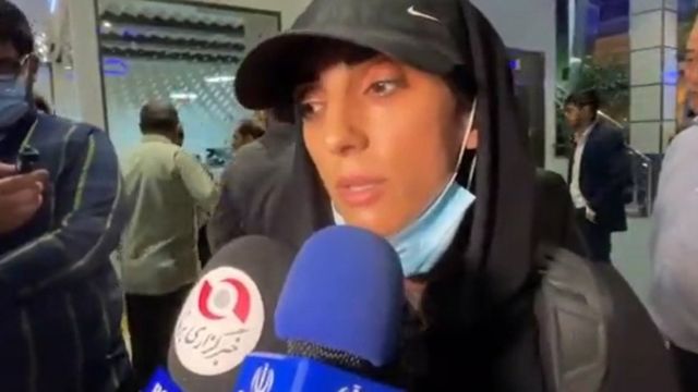 Elnaz Rekabi is interviewed by Iranian state media at Tehran's international airport on 19 October 2022