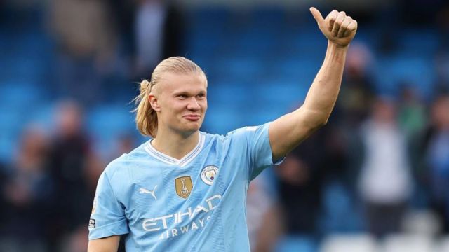 Erling Haaland of Manchester City gives a thumbs up to the fans
