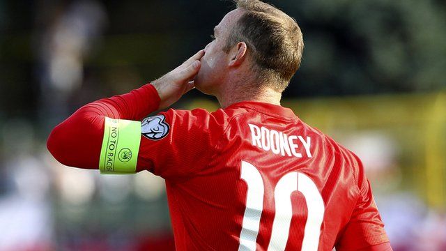 Wayne Rooney celebrates historic goal