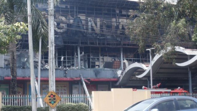 Smoke rises from buildings that protesters set ablaze.