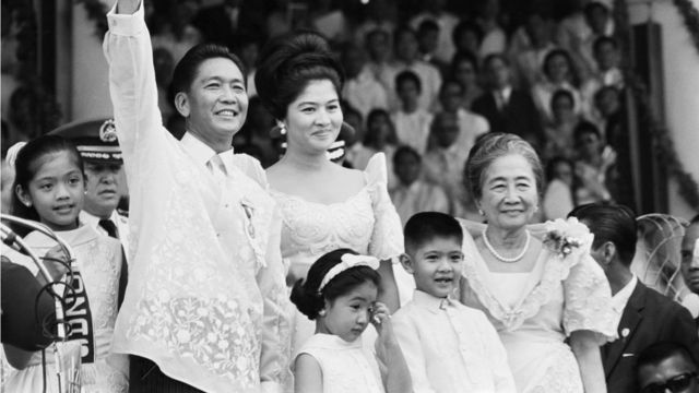 Standing with his family, Ferdinand Marcos waves to the crowd after his inauguration as the President of the Philippines on December 30, 1965