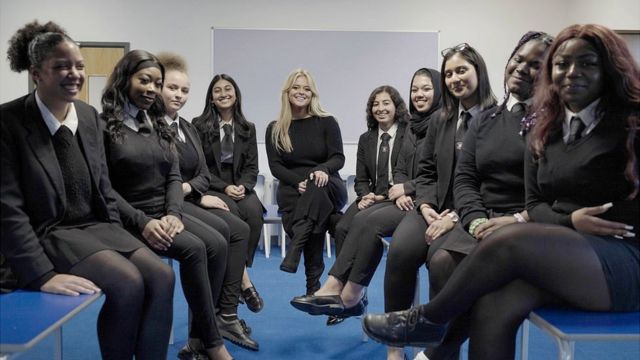 Emily Atack with high school students