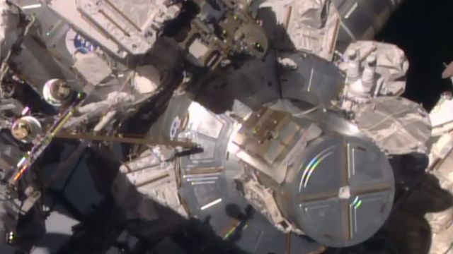 astronauts exit the airlock