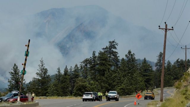 A police blockade outside Lytton, where a wildfire raged through and forced residents to evacuate, July 1, 2021