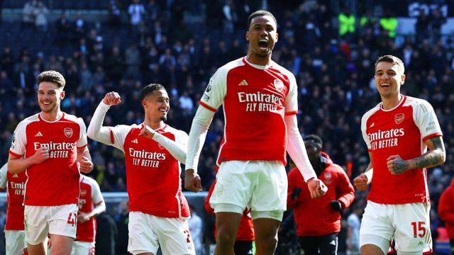 Arsenal players celebrate a victory