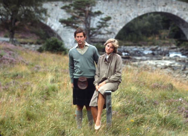 King Charles III and Diana, Princess of Wales, pose for a photo on the banks of the River Dee in the grounds of Balmoral Castle during their honeymoon on August 19, 1981.