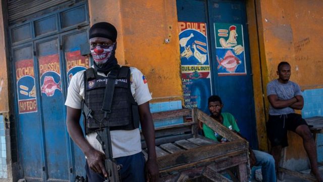 A policeman keeps watch in Haiti.