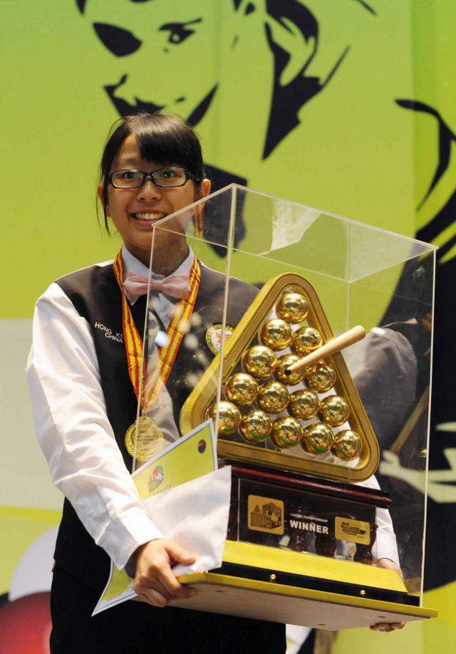Ng On Yee of Hong Kong poses with the winners trophy after winning the women's title of the World Snooker championship held at the Hyderabad International Convention Center (HICC) in Hyderabad on November 25, 2009
