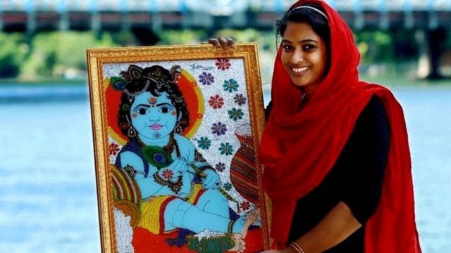 With a picture of Jasna Salim Krishna