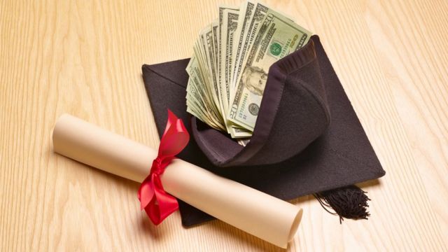 Image of a diploma next to a lot of money.