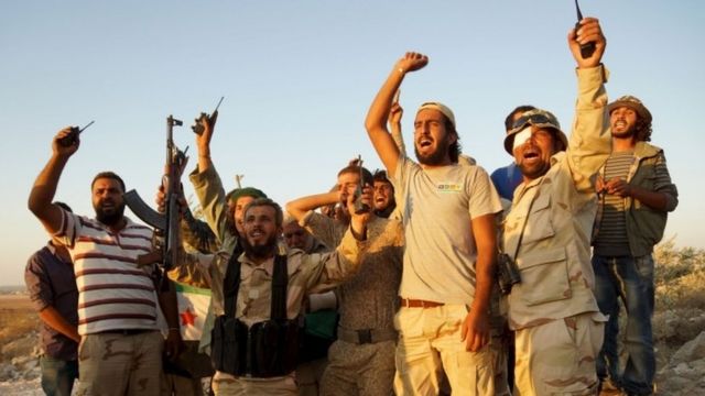Free Syrian Army fighters celebrate taking control of the city of Tal al-Zaatar (13 August 2015)