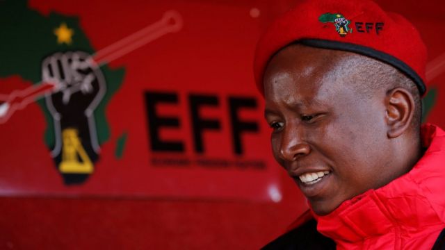 Julius Malema, leader of South Africa's s Economic Freedom Fighters (EFF) looks on before addressing his supporters in Etwatwa, a township near Benoni, South Africa - Wednesday 27 July 2016