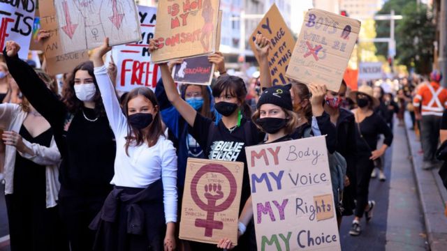 Women take part in a march in Sydney, Australia.