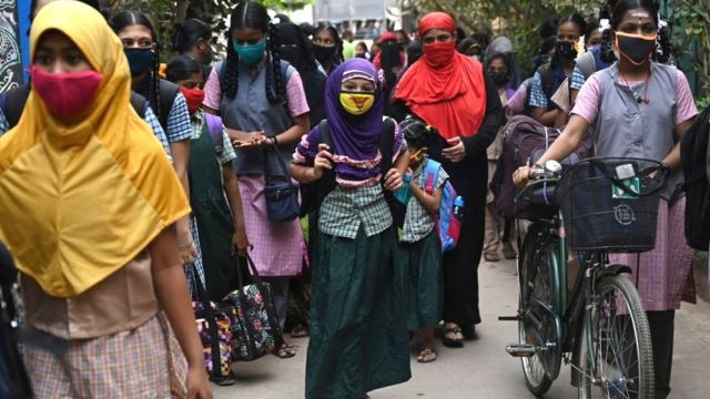 Students arrive to attend classes at a school in Madurai